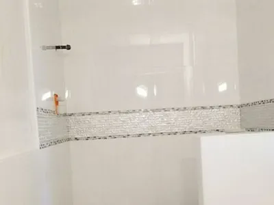 shower remodel with half-wall